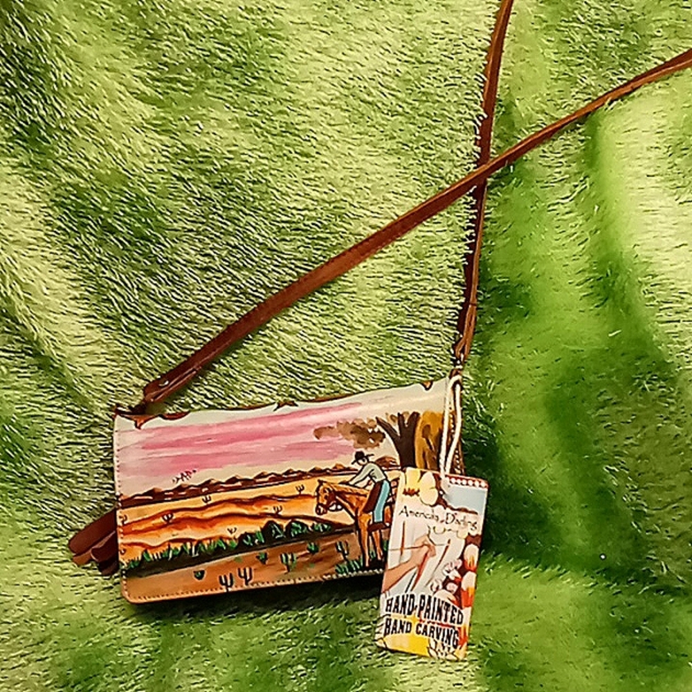 LEATHER WOMANS CLUTCH HAND CARVED AND PAINTED